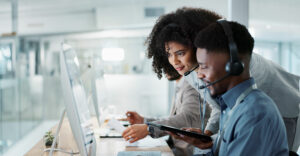 call center agents collaborate at the help desk