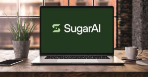 Laptop displaying the SugarAI brand following the company's rebranding from SugarCRM.